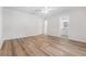 Bright bedroom with wood-look floors and bathroom access at 4020 S West Shore Blvd, Tampa, FL 33611