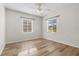 Bright bedroom with wood-look floors and ceiling fan at 4020 S West Shore Blvd, Tampa, FL 33611