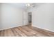 Spacious bedroom with wood-look floors and access to another room at 4020 S West Shore Blvd, Tampa, FL 33611