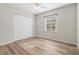 Bright bedroom with wood-look floors and a double door closet at 4020 S West Shore Blvd, Tampa, FL 33611