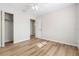 Bedroom with wood-look floors, ceiling fan, and access to closet and bathroom at 4020 S West Shore Blvd, Tampa, FL 33611