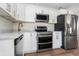 Modern kitchen with stainless steel appliances and white cabinets at 4020 S West Shore Blvd, Tampa, FL 33611