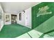 Screened porch with artificial turf and neon sign at 4020 S West Shore Blvd, Tampa, FL 33611