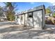 White storage shed with gable roof and windows at 4020 S West Shore Blvd, Tampa, FL 33611