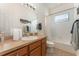 Bathroom with tub, shower, and wood vanity at 4079 Overture Cir # 346, Bradenton, FL 34209