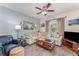 Light beige sectional sofa, wood coffee table and wood floors at 4079 Overture Cir # 346, Bradenton, FL 34209