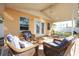 Relaxing back patio with covered seating area, wicker furniture, and ceiling fan at 4400 Carson Ne St, St Petersburg, FL 33703