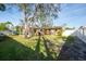 Large backyard with covered patio and a view of the house at 4400 Carson Ne St, St Petersburg, FL 33703