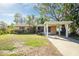 Single story home with carport and mature landscaping at 4400 Carson Ne St, St Petersburg, FL 33703