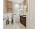 Updated bathroom with granite vanity and a glass shower at 4414 Waltham Dr, Tampa, FL 33634