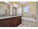 Elegant bathroom with granite countertops and a soaking tub at 4414 Waltham Dr, Tampa, FL 33634