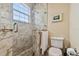 Modern bathroom with a walk-in shower and marble tile at 4414 Waltham Dr, Tampa, FL 33634