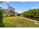 Landscaped backyard with canal access and private dock at 4414 Waltham Dr, Tampa, FL 33634