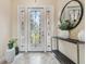 Elegant entry with a decorative door and a stylish console table at 4414 Waltham Dr, Tampa, FL 33634