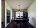 Dining room with wood floors and table for six at 4514 Arizona Sun Ct, Valrico, FL 33594