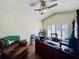 Home office with leather chair and wood floors at 4514 Arizona Sun Ct, Valrico, FL 33594