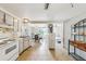 Kitchen with white appliances, light beige cabinets, and tile floors at 5157 School Rd, New Port Richey, FL 34653