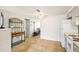 View of kitchen with white appliances and a kitchen island at 5157 School Rd, New Port Richey, FL 34653