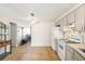 Bright kitchen features white appliances and light taupe cabinets at 5157 School Rd, New Port Richey, FL 34653