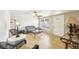 Living room featuring wicker furniture, tile floors, and a ceiling fan at 5157 School Rd, New Port Richey, FL 34653