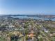 Aerial view of neighborhood showcasing lush greenery, waterway and waterfront cityscape at 540 Villagrande S Ave, St Petersburg, FL 33707