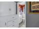 Classic bathroom featuring white cabinetry, neutral tile floors and modern fixtures at 540 Villagrande S Ave, St Petersburg, FL 33707