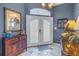 Bright foyer featuring double doors, tile floors, and stylish decor at 540 Villagrande S Ave, St Petersburg, FL 33707