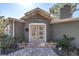 Charming front entrance with double doors, brick steps, and landscaped accents at 540 Villagrande S Ave, St Petersburg, FL 33707