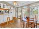 Bright and airy kitchen featuring breakfast nook with natural light from large windows at 540 Villagrande S Ave, St Petersburg, FL 33707