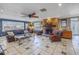 Cozy living room features a brick fireplace, tile floors, and comfortable leather furniture at 540 Villagrande S Ave, St Petersburg, FL 33707