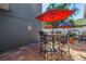 Outdoor patio with attractive tile flooring, dining table, chairs, and a decorative sun ornament at 540 Villagrande S Ave, St Petersburg, FL 33707