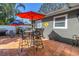 Outdoor patio with tile flooring, shaded by colorful umbrellas, perfect for entertaining or relaxing at 540 Villagrande S Ave, St Petersburg, FL 33707