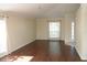 Inviting living room with gleaming hardwood floors and abundant natural light streaming through the windows at 5532 War Admiral Dr, Wesley Chapel, FL 33544