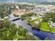 Stunning aerial view of riverfront property with lush landscaping and architectural buildings at 5644 Missouri Ave, New Port Richey, FL 34652