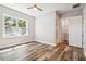 Bedroom featuring hardwood floors, natural light, and connecting bath at 5644 Missouri Ave, New Port Richey, FL 34652