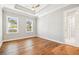 Relaxing bedroom with hardwood floors and two windows at 5644 Missouri Ave, New Port Richey, FL 34652