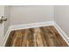 Walk-in closet features wood-look flooring, modern baseboards, and paint at 5644 Missouri Ave, New Port Richey, FL 34652