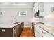 Modern kitchen island with stainless steel appliances and marble countertops at 5644 Missouri Ave, New Port Richey, FL 34652