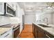 Modern kitchen equipped with stainless steel appliances and marble countertops at 5644 Missouri Ave, New Port Richey, FL 34652