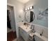 Bathroom with updated vanity and large mirror at 568 Seacrest Dr, Largo, FL 33771