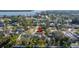 Aerial view of a house with a pool, located in a quiet neighborhood at 5720 Venetian Ne Blvd, St Petersburg, FL 33703