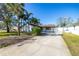 House exterior with driveway and landscaping at 5720 Venetian Ne Blvd, St Petersburg, FL 33703