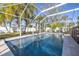 Inviting swimming pool with a screened enclosure at 5720 Venetian Ne Blvd, St Petersburg, FL 33703