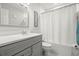 Clean bathroom with a gray vanity and a shower/tub combo at 6075 Shore S Blvd # 103, Gulfport, FL 33707