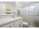 Clean bathroom with updated vanity and frosted glass shower at 6075 Shore S Blvd # 103, Gulfport, FL 33707