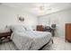 Bright bedroom with a queen-size bed and built-in workspace at 6075 Shore S Blvd # 103, Gulfport, FL 33707