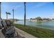 Relaxing patio overlooking the water with comfortable seating at 6075 Shore S Blvd # 103, Gulfport, FL 33707