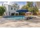 Inviting backyard oasis featuring a refreshing pool, spa, and ample lounge space at 620 26Th N Ave, St Petersburg, FL 33704