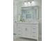 Elegant bathroom with white vanity, marble countertop, and large mirror at 620 26Th N Ave, St Petersburg, FL 33704