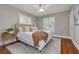 Spacious bedroom with hardwood floors, neutral walls and a cozy bed at 620 26Th N Ave, St Petersburg, FL 33704